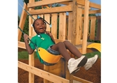 Smiling child on yellow swing seat